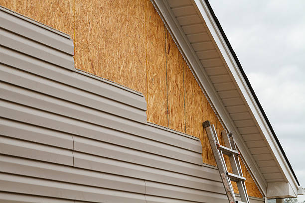 Professional Storm Damage Siding Repair technician working in Cuddy, PA